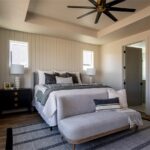 The room is empty and appears to be a bedroom with white walls and ceiling fan.