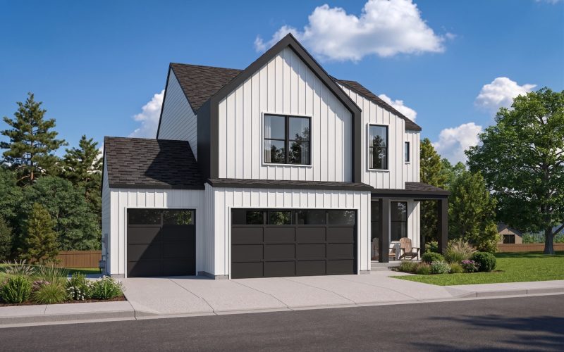 A white two-story house with a black roof and garage doors is surrounded by trees under a clear blue sky.